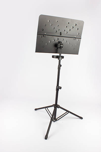 istock music stand with music book, black on a white background 2245698956