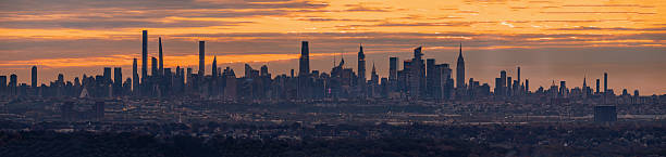 istock New York City skyline glows under a dramatic sunset sky. 2245703906