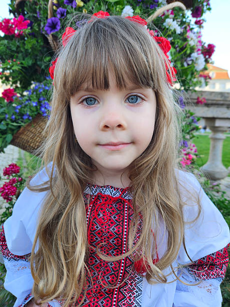 portrait of a little girl on the children's playground, smiling and enjoying shopping