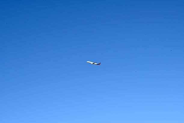 Evere, Brussels-capital, Belgium - November 08 2025: view from ground on silhouette flying commercial airplane Brussels Airlines departure from Zaventem airport