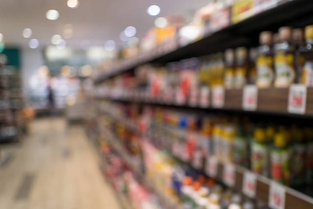 istock Defocused supermarket aisle background with generous copy space 2245711295