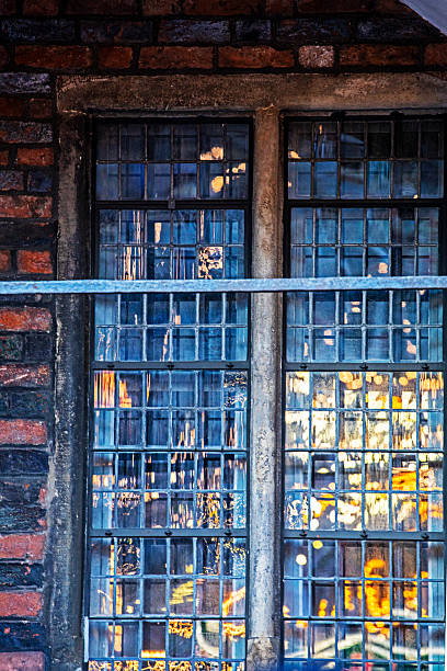 istock blurred reflection in the window of a Catholic church yesterday. 2245711354