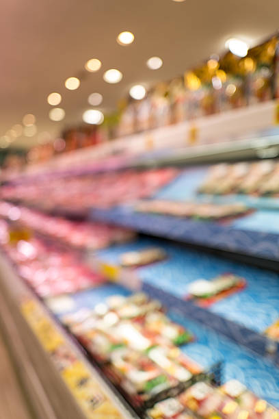 istock Defocused supermarket aisle background with generous copy space 2245711399