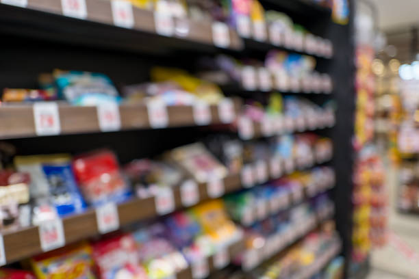 istock Defocused supermarket aisle background with generous copy space 2245711407