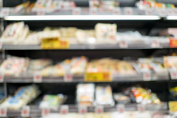 Pleasant blur of a grocery section aisle — ad-ready backdrop