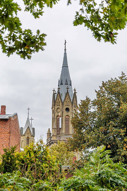 istock Ornate Church Spire Above Greenery 2245718825