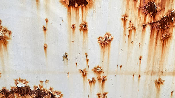 istock Grunge white painted metal texture with heavy vertical rust stains. Abstract industrial background. 2245721389