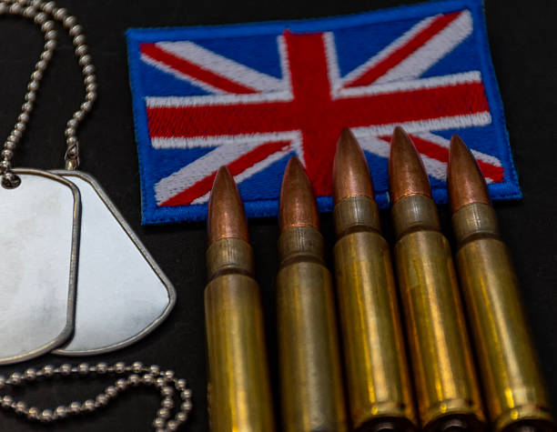istock United Kingdom flag patch with bullets and dog tags close up on black surface 2245722001