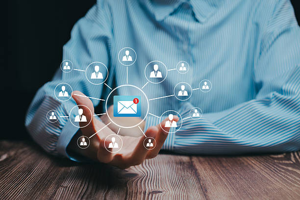 istock Email network concept. Businessman holding holographic communication icons representing email connections, business network, and online messaging across global organization. 2245722830
