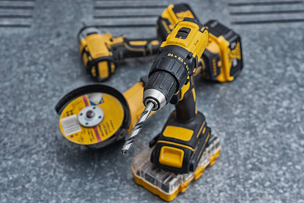 istock Cordless drill with a metal drill bit, angle grinder and impact wrench on a steel surface. Concept of construction, workshop tools, industrial work, maintenance and professional craftsmanship. 2245727367