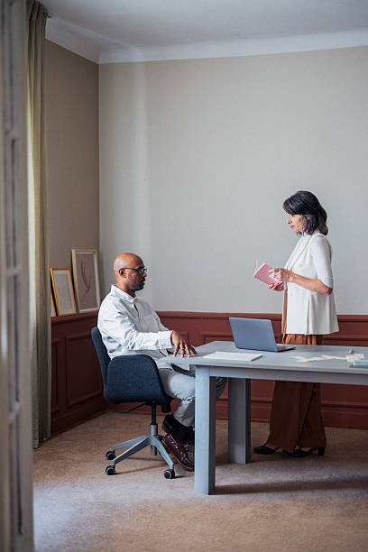 istock Professional Office Meeting Between Colleague And Visitor In Modern Workspace, Sharing Ideas 2245727968
