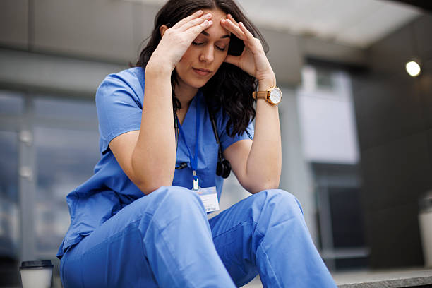 istock Nurse Experiencing Stress and Taking a Quiet Moment of Rest 2245728378