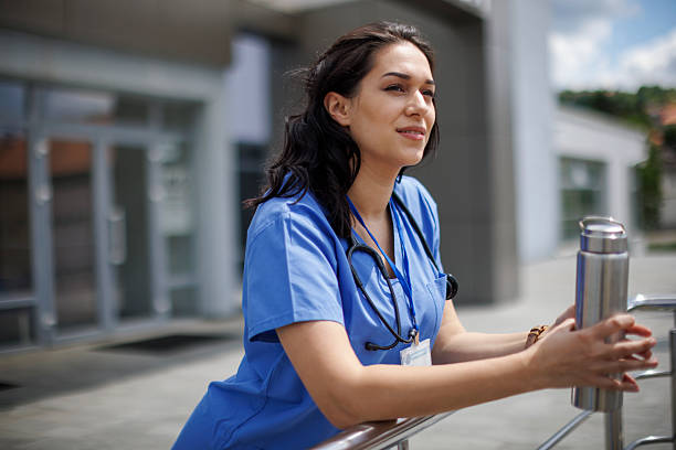 istock Medical Professional Relaxing Outside Modern Clinic 2245729023