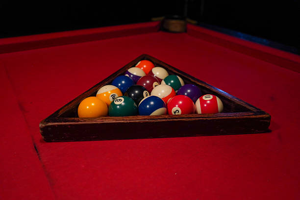 istock Close-up of pool balls arranged in a triangle before a game 2245730486
