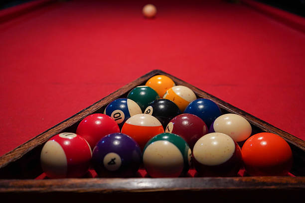 istock Close-up of pool balls arranged in a triangle before a game 2245730623