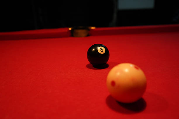 istock Pool table with 8-ball and cue ball ready for the final shot 2245730894