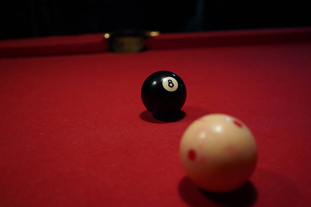 istock Pool table with 8-ball and cue ball ready for the final shot 2245730896