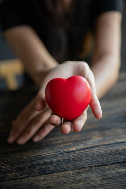 istock Woman showing red heart in her hands 2245736543