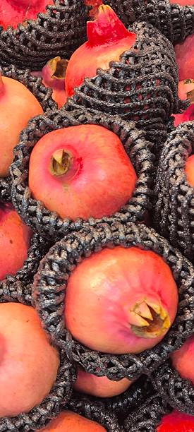 istock Red pomegranates in a fruit shop 2245741171