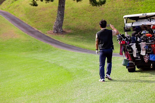 A middle-aged Japanese man enjoying golf
