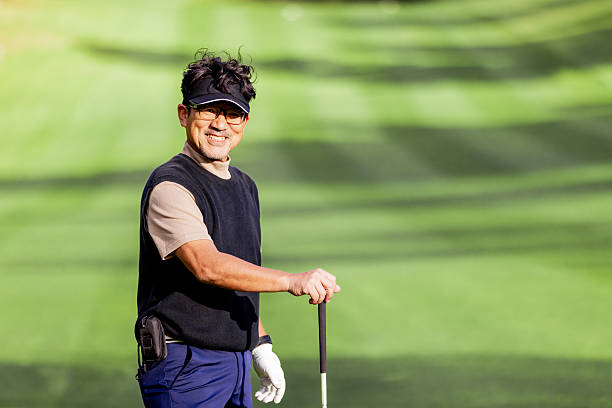 Vietnam Veteran wearing veteran cap enjoying the day on the golf course.