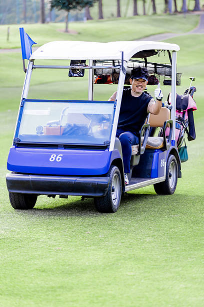 A middle-aged Japanese man enjoying golf