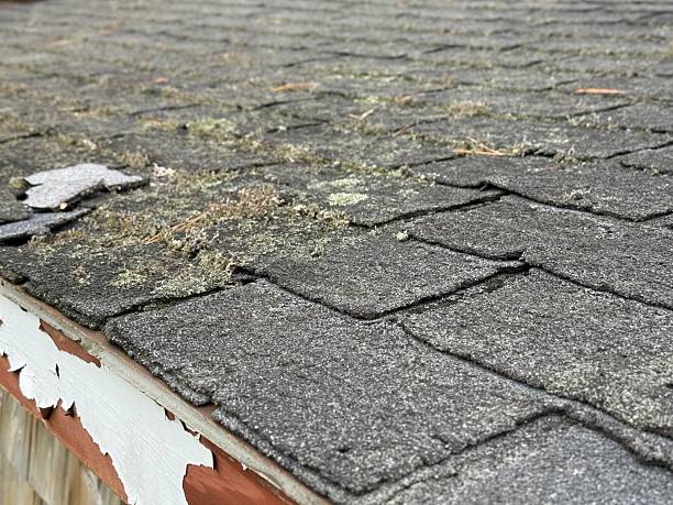 istock Wind damaged house roof with missing asphalt shingles after hurricane 2245753072