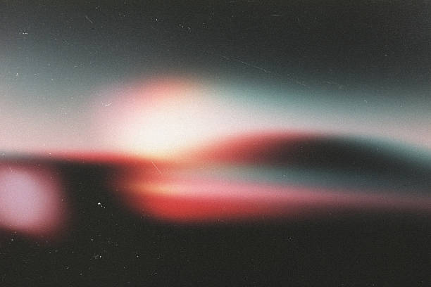istock light leak overlay effect with dust and blur pink light,Abstract background with lens,retro  flim noisy grain dust texture on black background,old photo overlay texture,old film burn background 2245763178