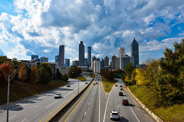 Atlanta, GA, USA: August 31,2024: Panoramic view of Atlanta skyline during sunset, long exposure with light trails short from Old Fourth ward in downtown Atlanta, USA
