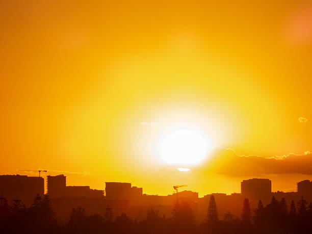 The sun sets on a hot and sunny day in Sydney. This image was taken from Shep's Mound, Ross Smith Avenue at Sydney Kingsford Smith Airport on 8 November 2025.