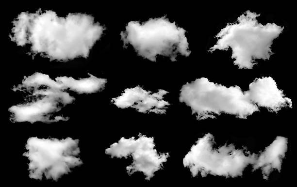 istock Set of fluffy white clouds isolated on black background, realistic sky elements ideal for weather design, photo editing, and digital illustration projects. 2245783730
