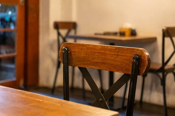 istock Seating inside the cafe or restaurant, with wooden chairs and table 2245784572