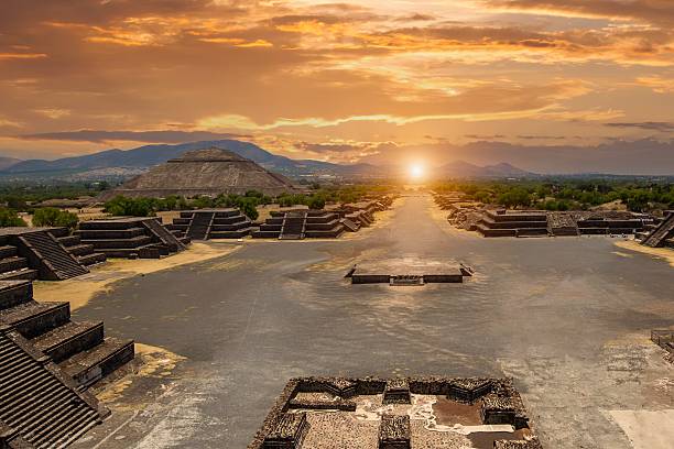 istock Ancient city ruins at sunset with mountain backdrop 2245786695