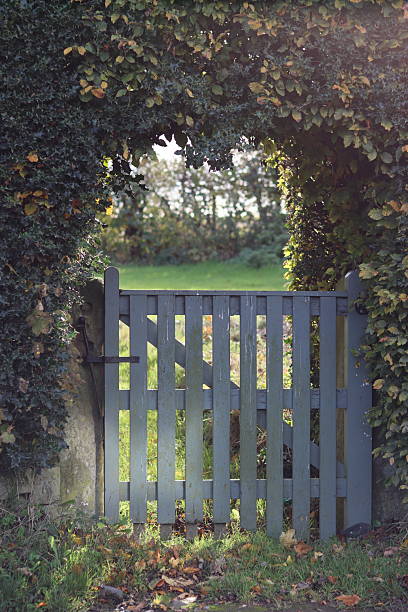Gate leading through a hedge into a garden