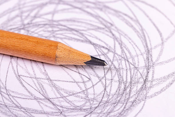 a black graphite pencil,  thin chaotic lines drawn on thin paper with a pencil with a black lead, close up
