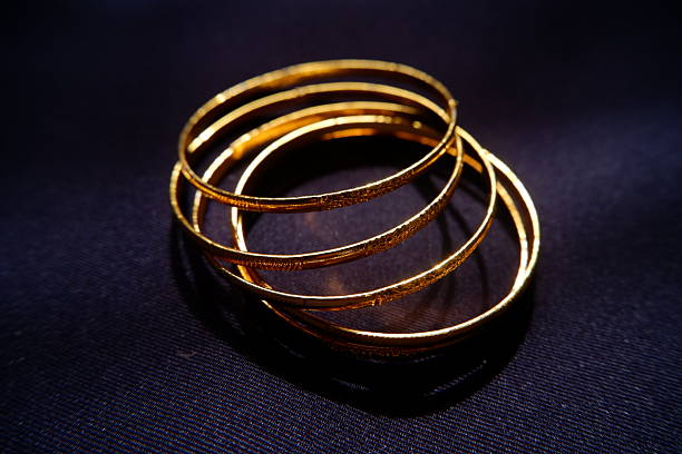 istock Golden Accessories on Dark Surface  Glamour Still Life 2245791642