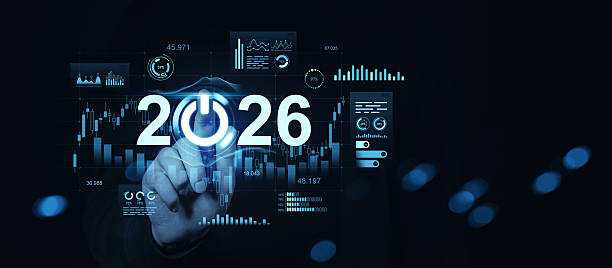 istock Futuristic 2026 concept with digital data charts and hand pressing power symbol in blue interface on dark background for technology innovation themes. 2245793413