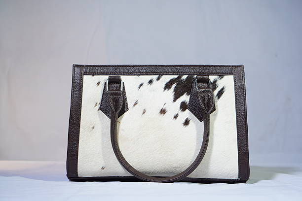 istock Cowhide and leather handbag with unique spot pattern, perfect for adding flair. 2245798525