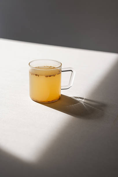 istock A clear glass cup of Korean ginger tea on a white table in sunlight 2245803197