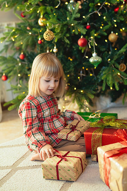 istock Child with Christmas presents 2245803519