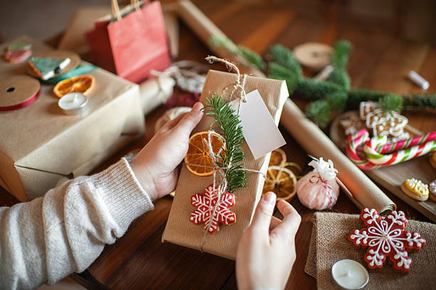 istock Young woman preparing Christmas gifts 2245803635