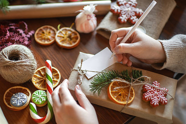 istock Young woman preparing Christmas gifts 2245803663