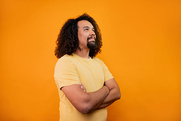istock Young man contemplating looking away in a studio shot 2245804042
