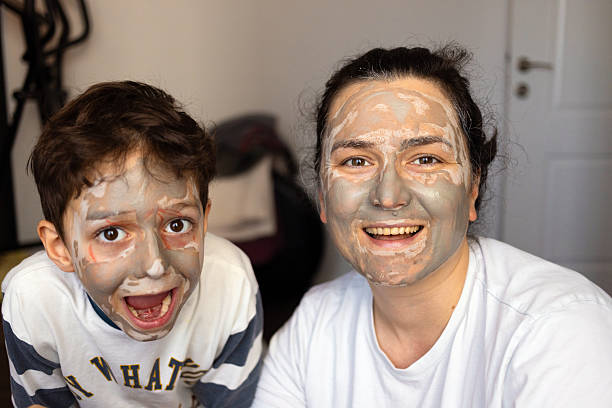istock Mother and son having skin care 2245804337