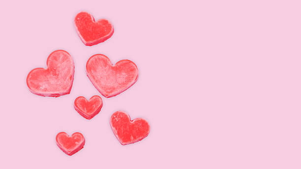 istock Red ice cream in a heart shape on a pink background. 2245806757