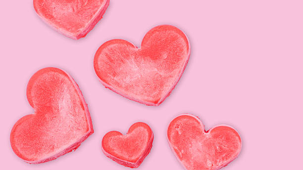 istock Red ice cream in a heart shape on a pink background. 2245806810
