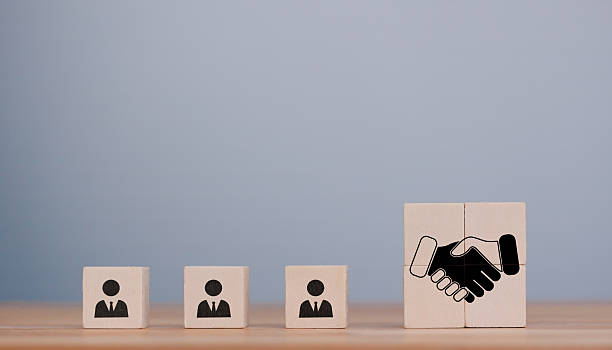 istock Enhancing workplace collaboration and empathy among teams building trust and leadership with wooden blocks representing emotional intelligence and diversity 2245808197