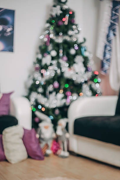 istock Cozy Christmas Living Room with Blurred Tree Lights 2245812166