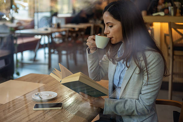 istock Calm and Focused Businesswoman Reading During Work Break 2245812302