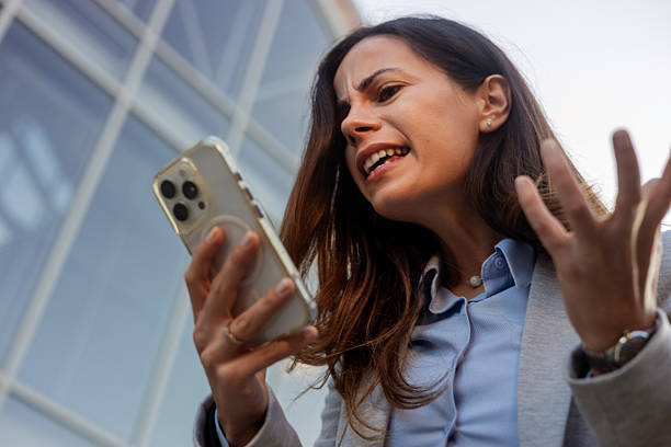 istock Stressed Executive Reacting to Bad News on Smartphone – Work Pressure Concept 2245812346